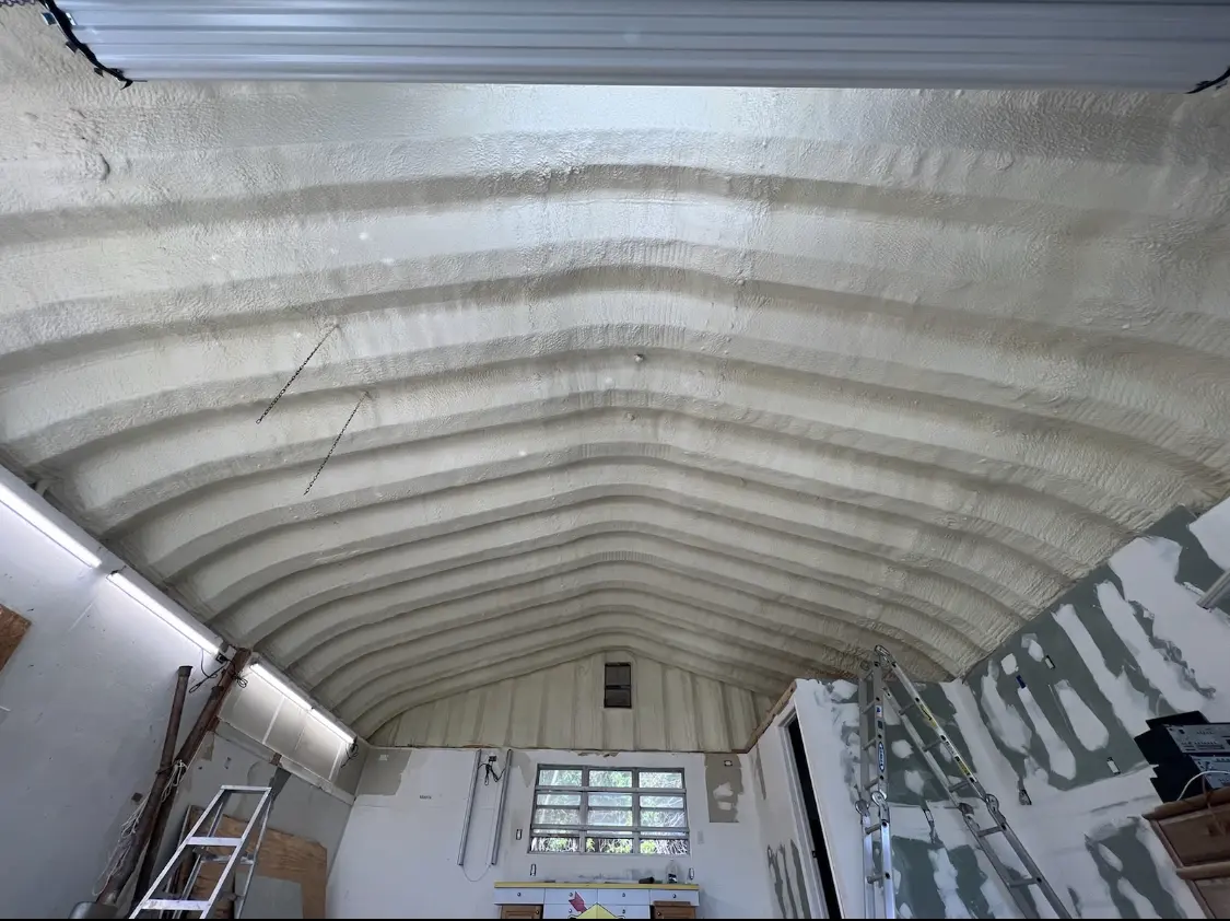 Spray polyurethane foam applied to the underside of a metal roof deck in Tittabawassee